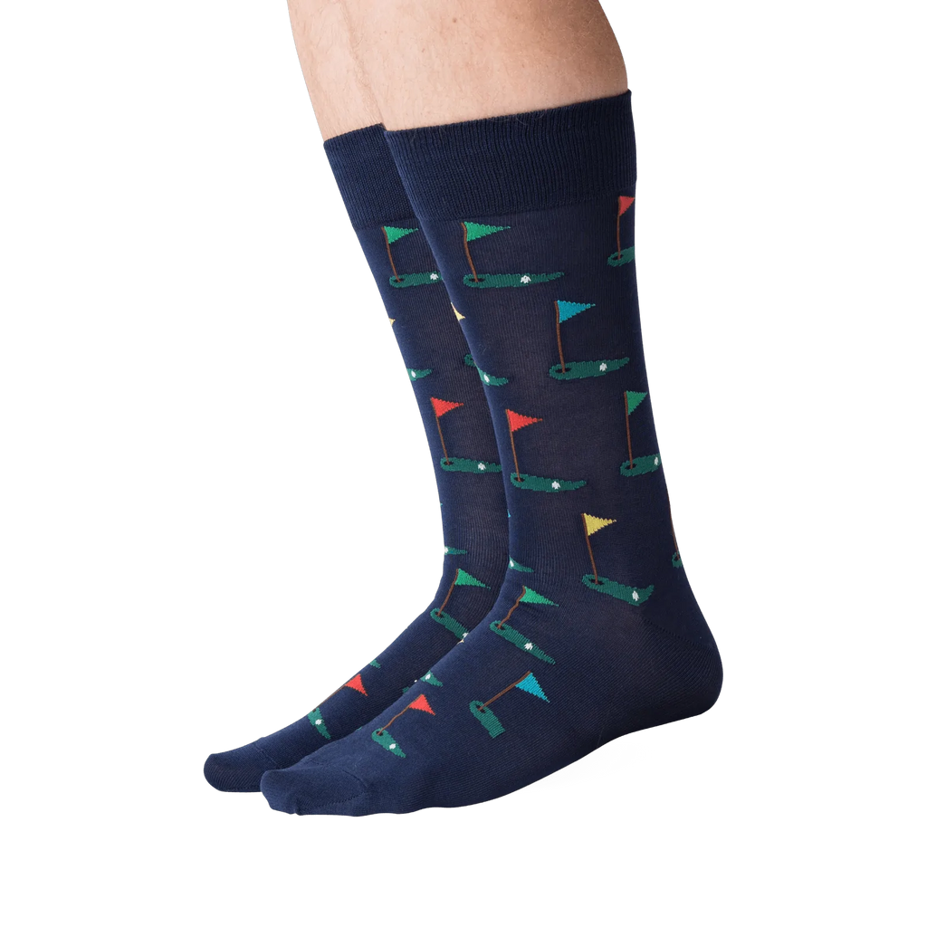 Navy socks with colorful flag pattern worn by a person on a white background