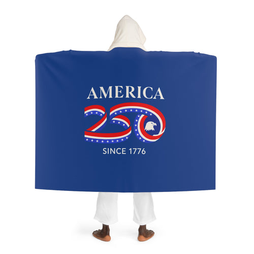 Person wearing a blue cape with 'America 250 Since 1776' text and design.