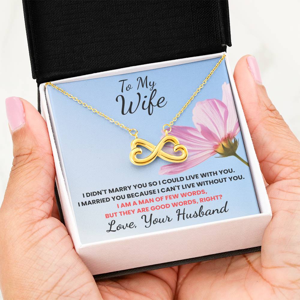 Gold infinity necklace in a gift box with a sentimental message for a wife.