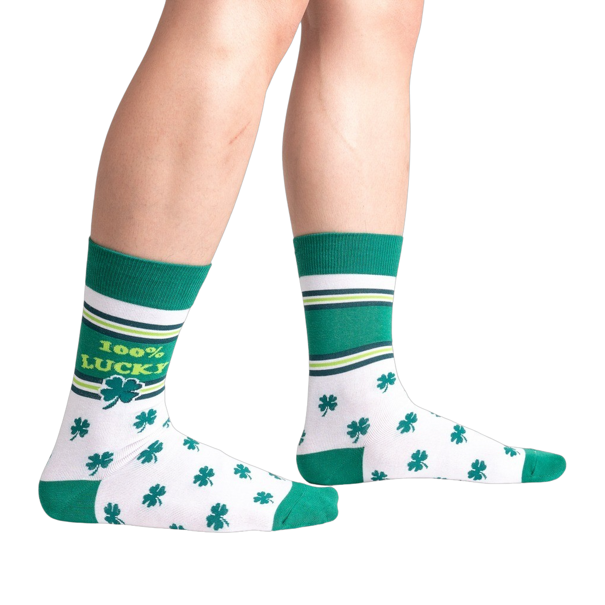 Green and white socks with shamrock pattern worn by a person on a white background
