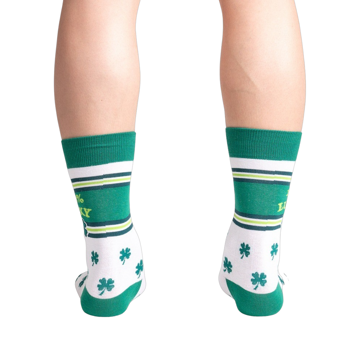 Green and white socks with shamrock pattern worn by a person on a white background