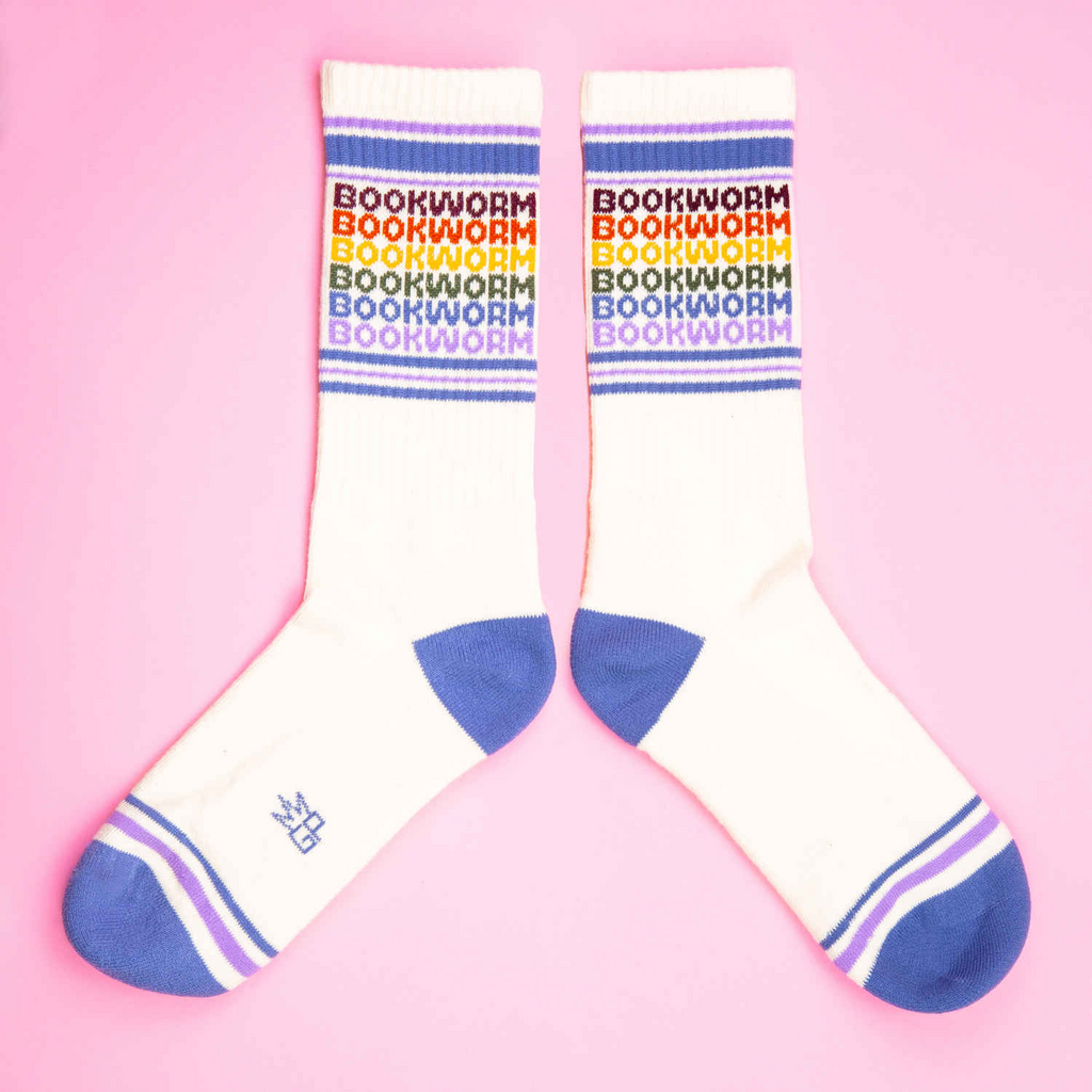 Pair of socks with 'bookworm' text on a pink background