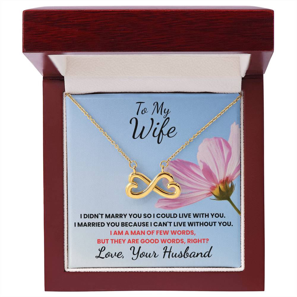 Gold infinity necklace in a gift box with a sentimental message for a wife.
