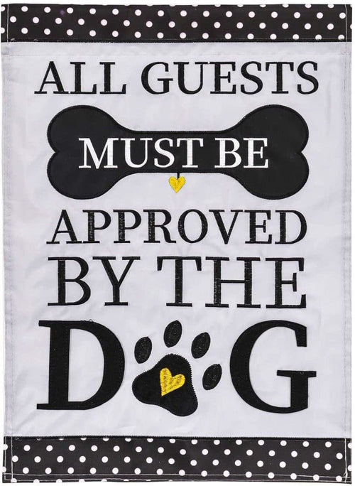 Decorative flag with text 'All guests must be approved by the dog' on a white background with black polka dots.