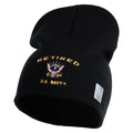 Green knit beanie with 'Retired U.S. Navy' embroidery on a white background