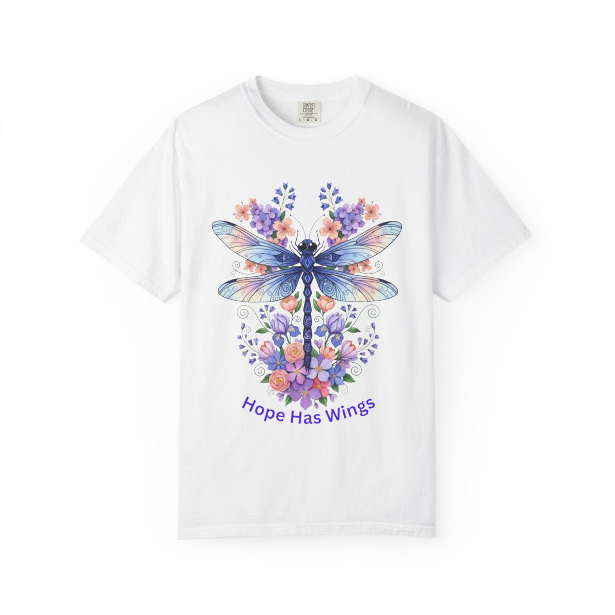 A white short-sleeve crewneck t-shirt featuring a colorful graphic of a dragonfly surrounded by purple and orange flowers, with the text 'Hope Has Wings' printed below in purple, displayed on a clean white background.