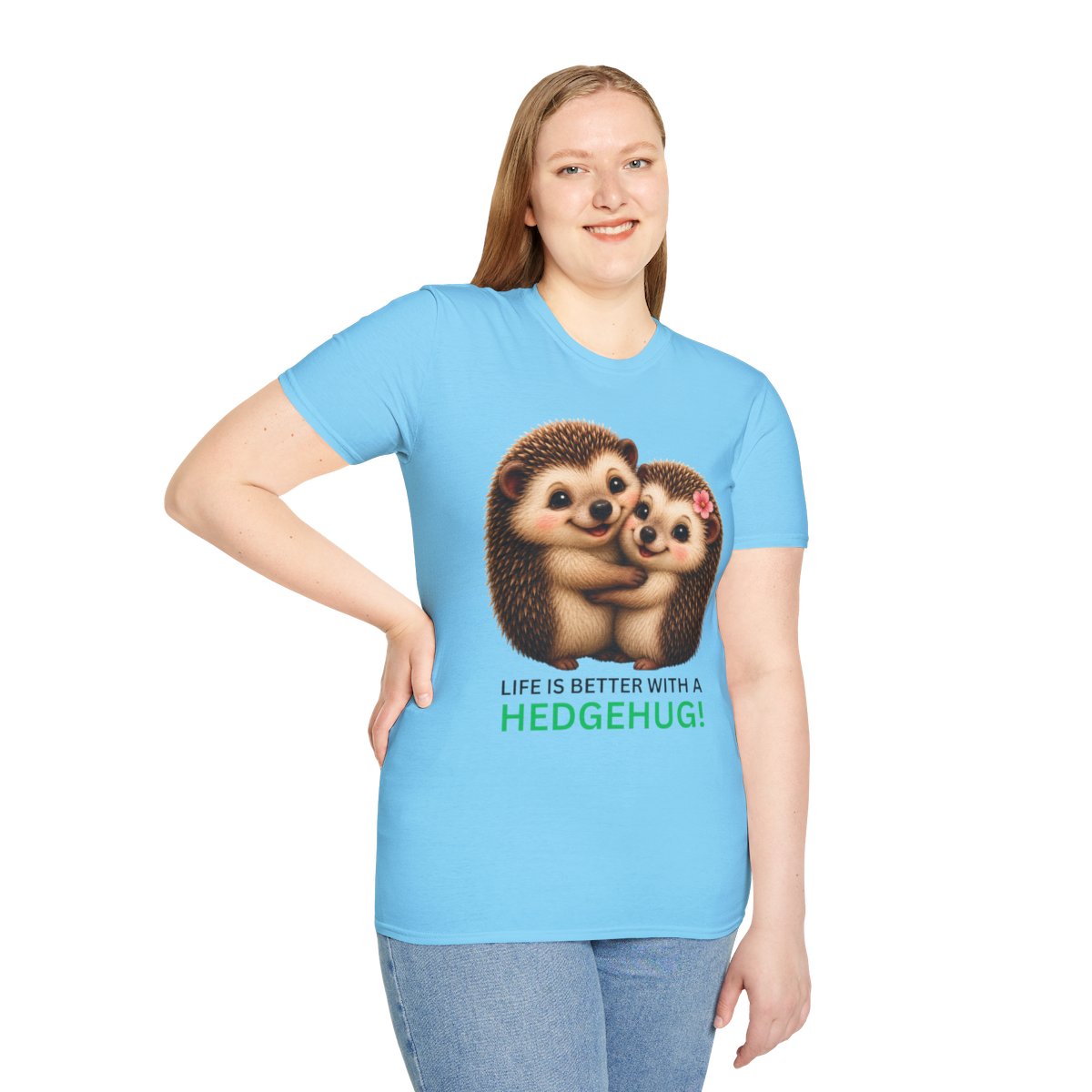 A woman modeling a light blue short-sleeve t-shirt with a graphic of two hedgehogs hugging and the text 'LIFE IS BETTER WITH A HEDGEHUG!' printed on the front, set against a plain white background.