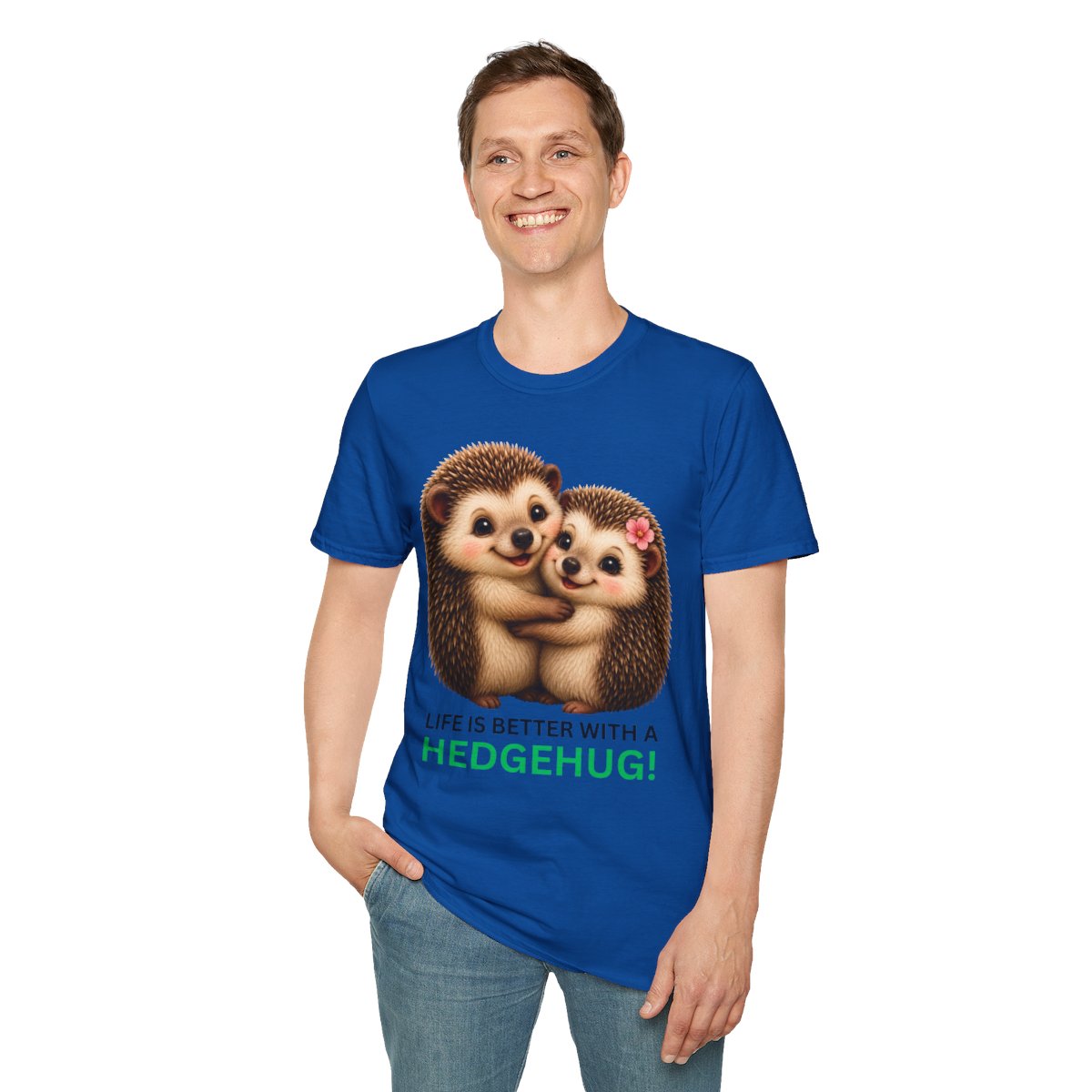 A man wearing a royal blue t-shirt with a graphic of two hugging hedgehogs and the text 'IT IS BETTER WITH A HEDGEHUG!' in green and white, paired with blue jeans against a plain white background.