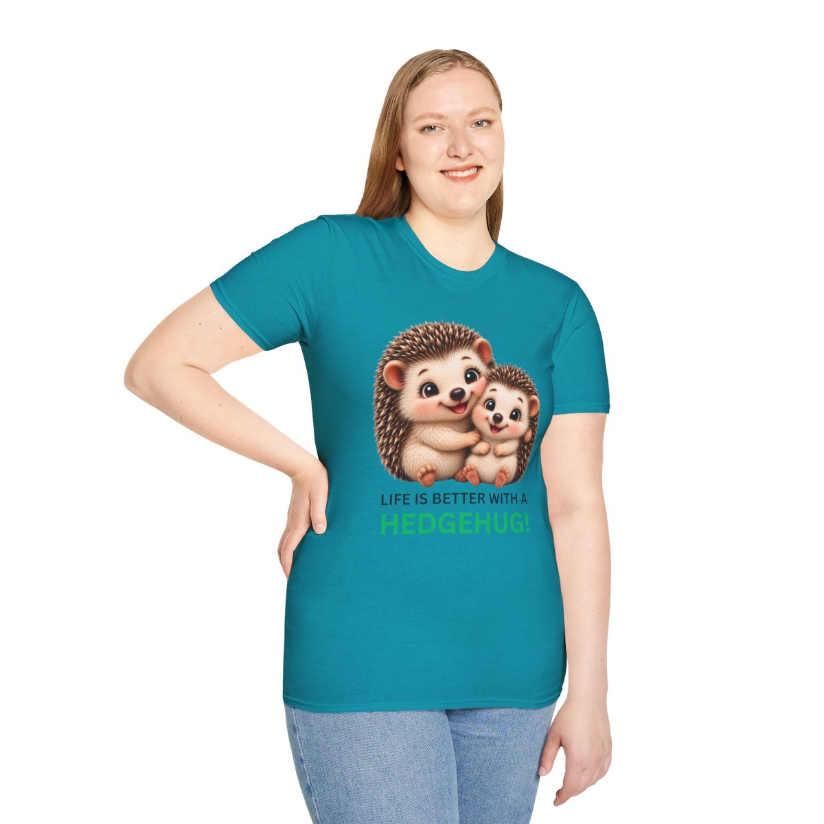 A woman modeling a teal short-sleeve t-shirt with a graphic of two hedgehogs and the text 'LIFE IS BETTER WITH A HEDGEHUG!'.