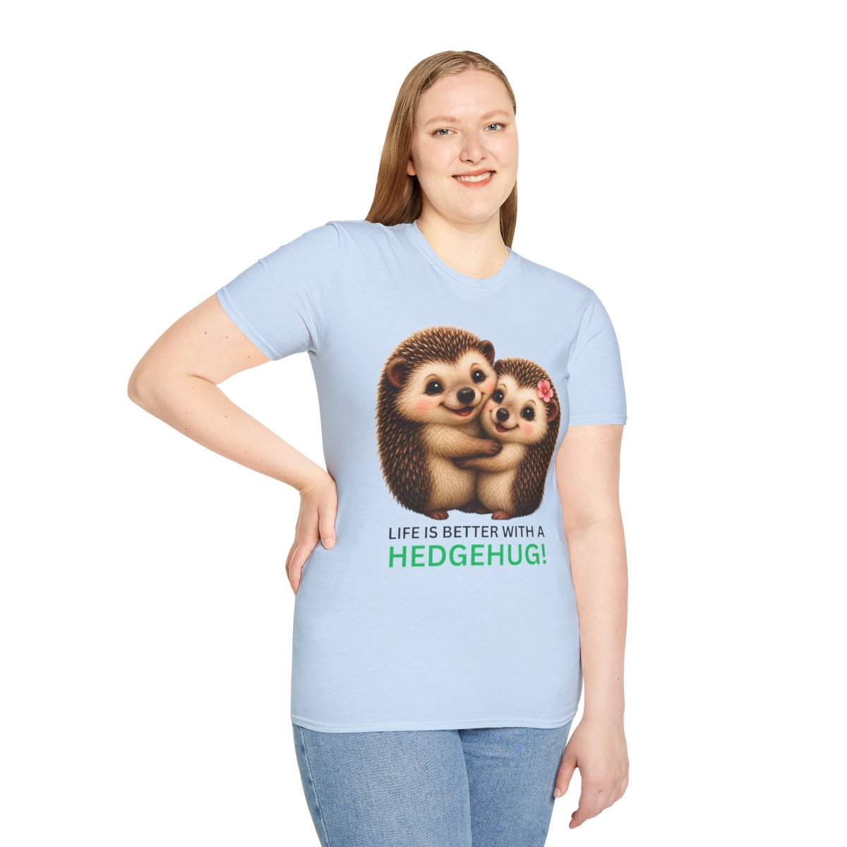 A woman modeling a light blue short-sleeve t-shirt with a graphic of two hugging hedgehogs and the text 'LIFE IS BETTER WITH A HEDGEHUG!'.