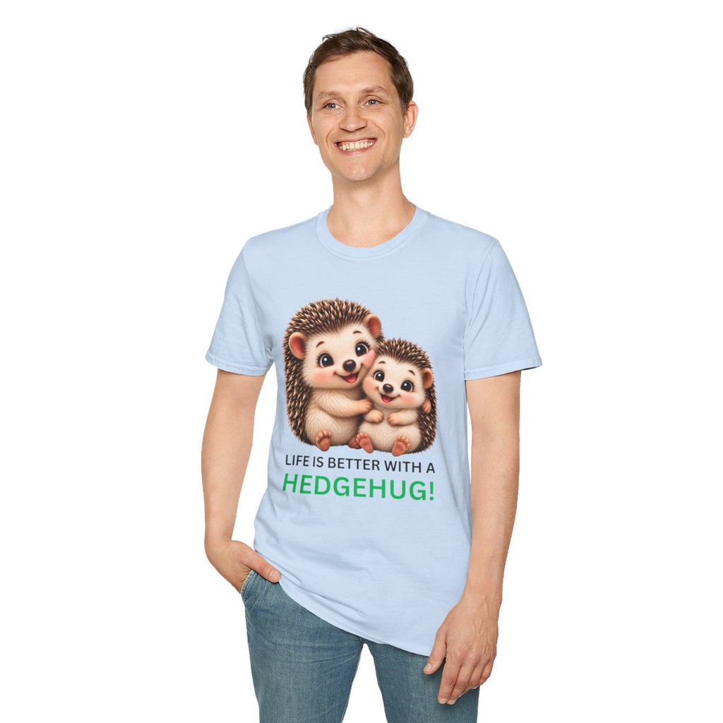 A man wearing a light blue t-shirt with a graphic of two cartoon hedgehogs and the text 'LIFE IS BETTER WITH A HEDGEHUG!' in green and black, paired with blue jeans against a plain white background.