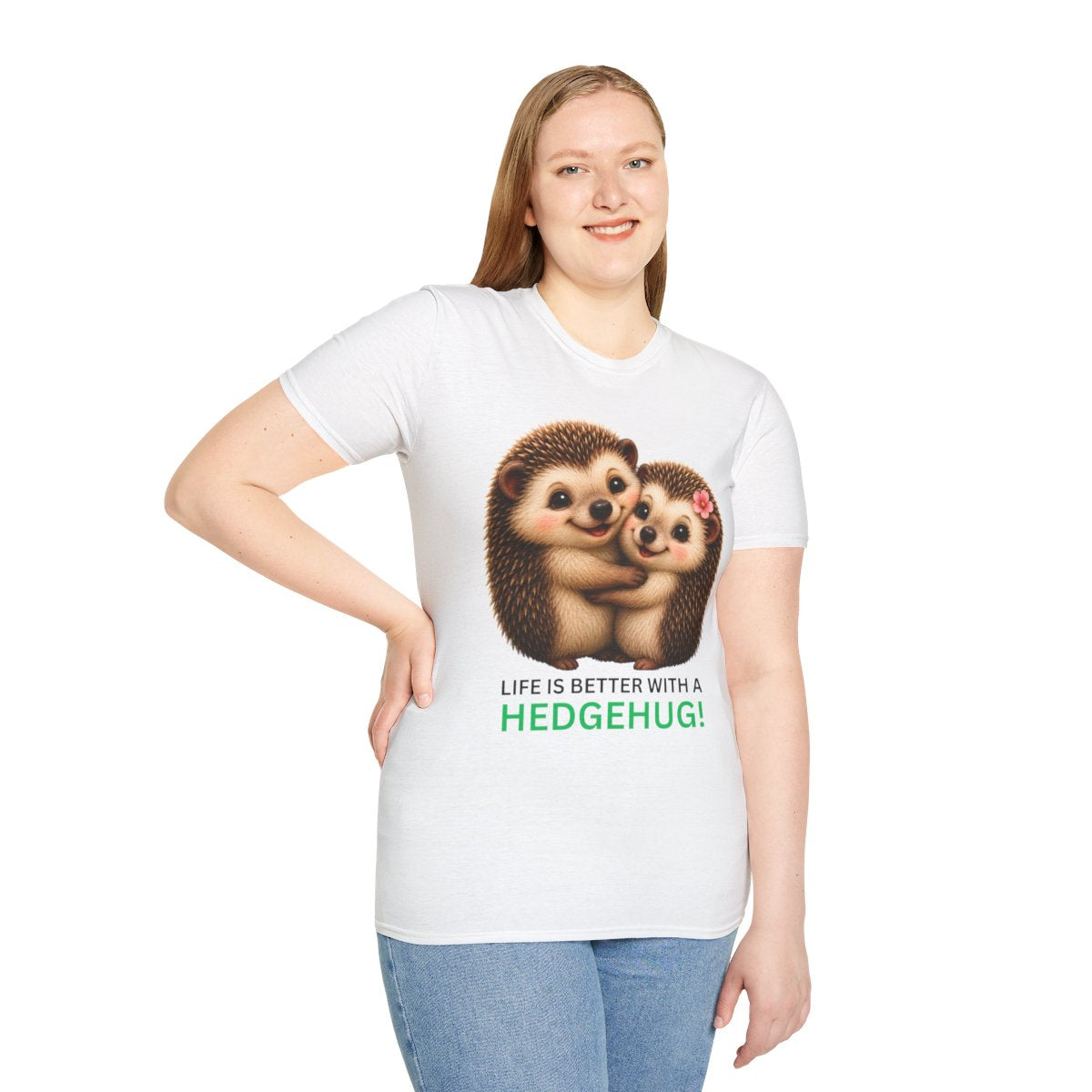 A woman modeling a white short-sleeve t-shirt with a graphic of two hugging hedgehogs and the text 'LIFE IS BETTER WITH A HEDGEHUG!'.