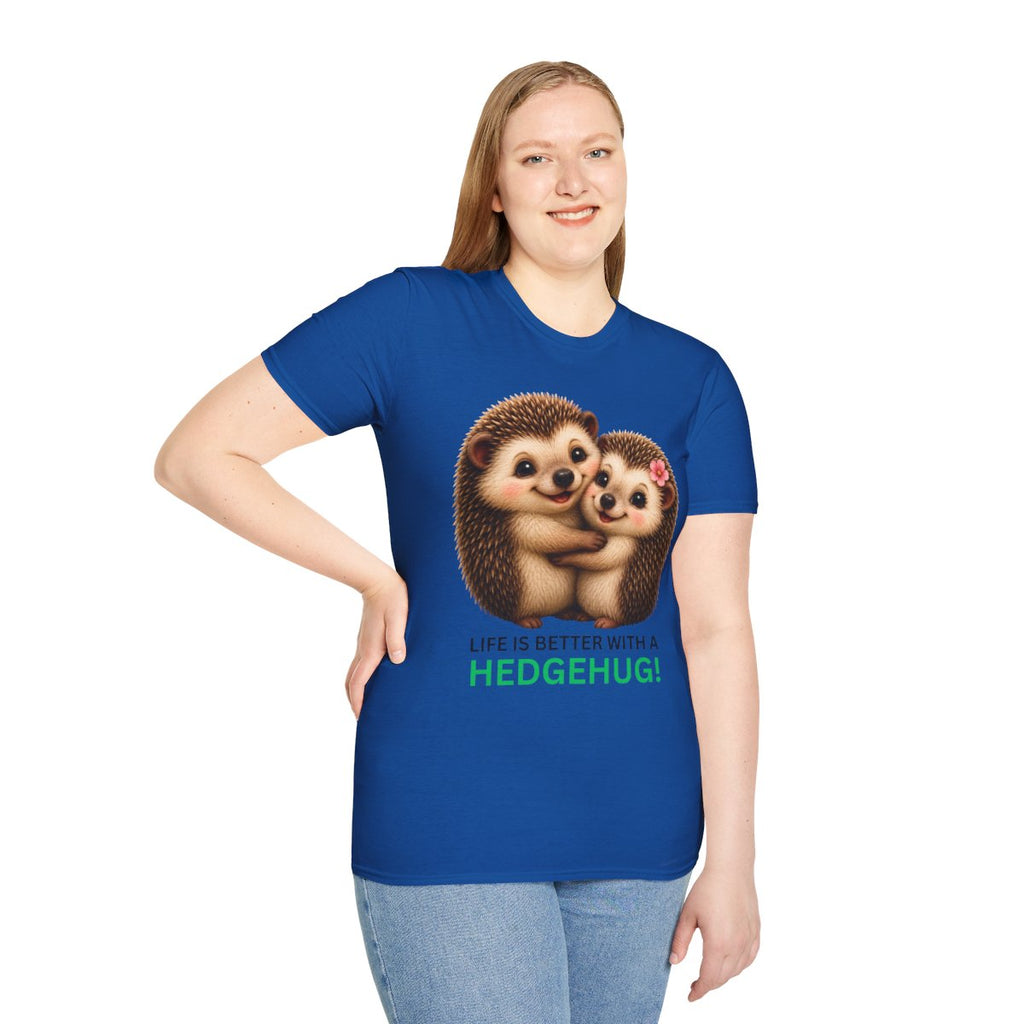 A woman modeling a royal blue short-sleeve t-shirt with a graphic of two hedgehogs hugging and the text 'LIFE IS BETTER WITH A HEDGEHUG!' in green and white, set against a plain white background.