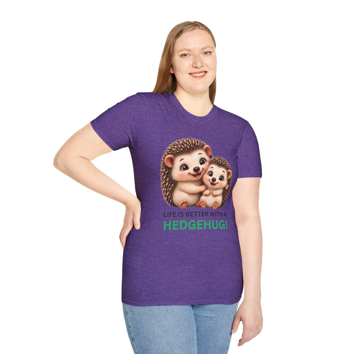 A woman modeling a purple heather graphic t-shirt featuring two hedgehogs and the text 'LIFE IS BETTER WITH A HEDGEHUG!'.